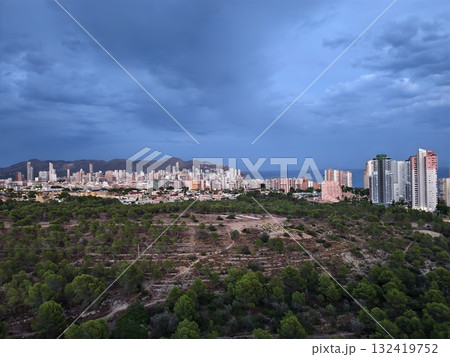 evening lights in busy city, twilight hours bring vibrant lights and active traffic through city evening lights in busy city, twilight hours bring vibrant lights and active traffic through city 132419752