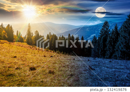 landscape with coniferous forest behind the meadow on autumn equinox. day and night time change concept. nature background with blue sky and mountain ridge with sun and moon. alpine woodland landscape with coniferous forest behind the meadow on autumn equinox. day and night time change concept. nature background with blue sky and mountain ridge with sun and moon. alpine woodland 132419876