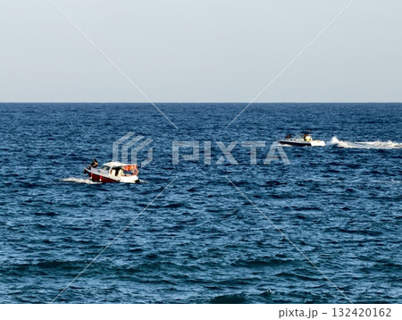 rescue vessel chases jet ski over waves, rescue boats pursue jet skis amid choppy waters and spray rescue vessel chases jet ski over waves, rescue boats pursue jet skis amid choppy waters and spray 132420162