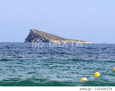 relaxing turquoise island getaway, sunlit turquoise water with distant island marking swim zone relaxing turquoise island getaway, sunlit turquoise water with distant island marking swim zone 132420179