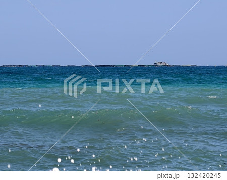 calm sea outing, relaxing coastal ocean scene, tranquil turquoise waters with distant boat calm sea outing, relaxing coastal ocean scene, tranquil turquoise waters with distant boat 132420245