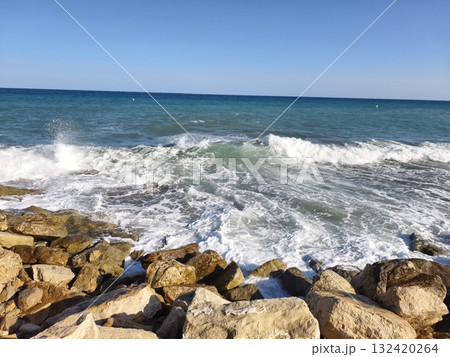 wave crash scene, vigorous ocean waves striking rugged boulders produce engaging marine and coastal wave crash scene, vigorous ocean waves striking rugged boulders produce engaging marine and coastal 132420264