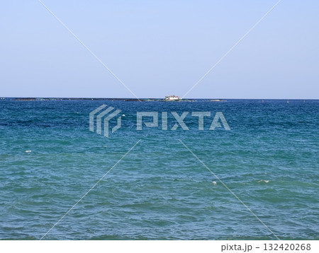 serene ocean view, serene turquoise expanse featuring distant boat on calm waters beneath clear sky serene ocean view, serene turquoise expanse featuring distant boat on calm waters beneath clear sky 132420268