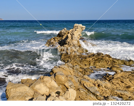 seaside rock formation, rock pier by ocean shore, rocky pier stretches into sea at low tide seaside rock formation, rock pier by ocean shore, rocky pier stretches into sea at low tide 132420272