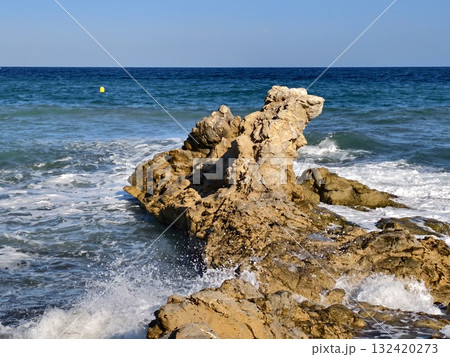 sturdy seaside tower, majestic monolithic rock enduring turbulent ocean surf and bright sunlight sturdy seaside tower, majestic monolithic rock enduring turbulent ocean surf and bright sunlight 132420273