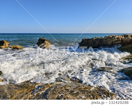 foam moves silently, foam drifts over rocky surface, retreating foam forms swirling patterns foam moves silently, foam drifts over rocky surface, retreating foam forms swirling patterns 132420286