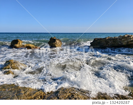 wave spray eruption, energetic wave eruption near coastal rocks with vibrant spray and textured 132420287