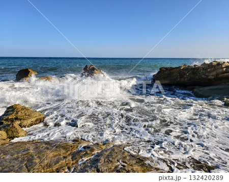 coastal seascape panorama, calm horizon over textured foreground with shimmering reflections coastal seascape panorama, calm horizon over textured foreground with shimmering reflections 132420289