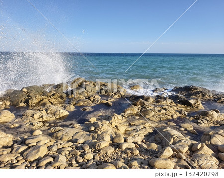 dynamic coastal spray against sunrise sky perfect for social media and environmental storytelling 132420298