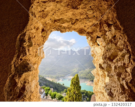 scenic mountain view, beautiful rocky window frames tranquil valley with warm light and dramatic scenic mountain view, beautiful rocky window frames tranquil valley with warm light and dramatic 132420317