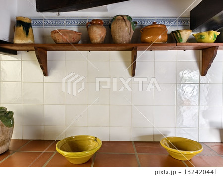 rustic kitchen setup with handmade ceramics, cozy cottagecore kitchen with terracotta and glazed rustic kitchen setup with handmade ceramics, cozy cottagecore kitchen with terracotta and glazed 132420441