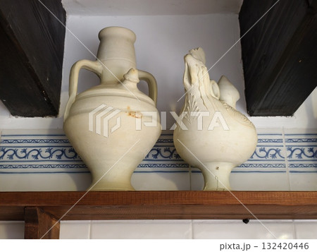 traditional handmade ceramic rooster pitcher and urn ensemble evoking rustic charm and warmth traditional handmade ceramic rooster pitcher and urn ensemble evoking rustic charm and warmth 132420446