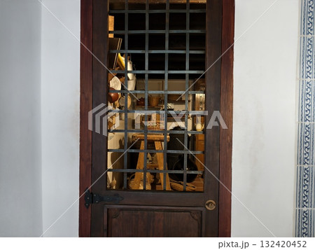 vintage instrument showcase, oldfashioned instrument display protected by metal mesh and wood frame vintage instrument showcase, oldfashioned instrument display protected by metal mesh and wood frame 132420452