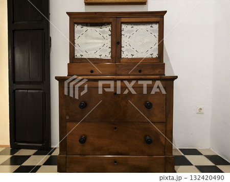 elegant vintage furniture, classic walnut dresser with mirrored cabinet and traditional details 132420490