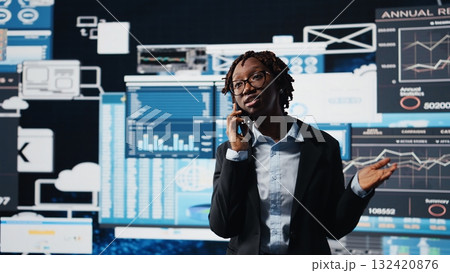 Manager doing telephone call with shareholders, talking about business market graphs, doing brainstorming. Businesswoman chatting with partners in call about financial reports, camera A 132420876