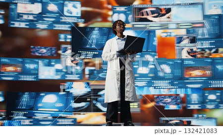 Female scientist looking at genomes on laptop screen, comparing infection models. African american biomedical engineer studying pathogens using notebook to design antiviral strategies, camera A Female scientist looking at genomes on laptop screen, comparing infection models. African american biomedical engineer studying pathogens using notebook to design antiviral strategies, camera A 132421083