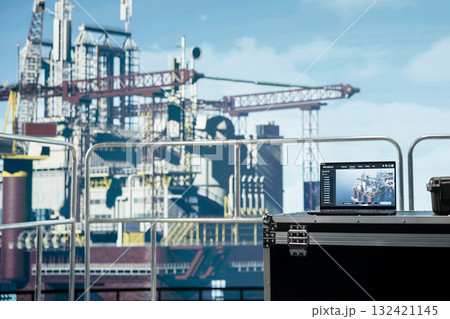 Laptop on offshore platform with software used to monitor equipment components performance in real time. Notebook on drilling rig deck used to calibrate infrastructure with asset management system Laptop on offshore platform with software used to monitor equipment components performance in real time. Notebook on drilling rig deck used to calibrate infrastructure with asset management system 132421145