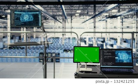 Mockup device in data center with supercomputers gear built for artificial intelligence prediction models. Green screen tablet in server room with neural networks tech detecting data patterns 132421255