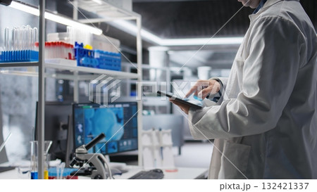 Close up of tablet with modern laboratory software used by scientist for a science experiment, advanced tech. Focused on molecular biology, biotechnology and healthcare innovation. Close up of tablet with modern laboratory software used by scientist for a science experiment, advanced tech. Focused on molecular biology, biotechnology and healthcare innovation. 132421337