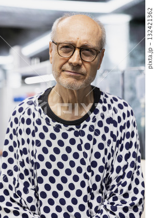 Portrait of senior man participating in clinical trial for health innovation, sitting in the research laboratory waiting for vitals examination and consultation. RD strategy for innovation. Portrait of senior man participating in clinical trial for health innovation, sitting in the research laboratory waiting for vitals examination and consultation. RD strategy for innovation. 132421362