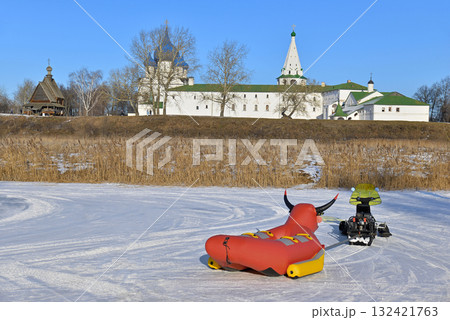 Winter activities, snowmobile with an inflatable bull 132421763