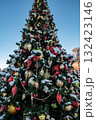 Christmas tree and New Year decorations on the town square on a frosty winter day. 132423146