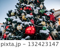 Christmas tree and New Year decorations on the town square on a frosty winter day. 132423147