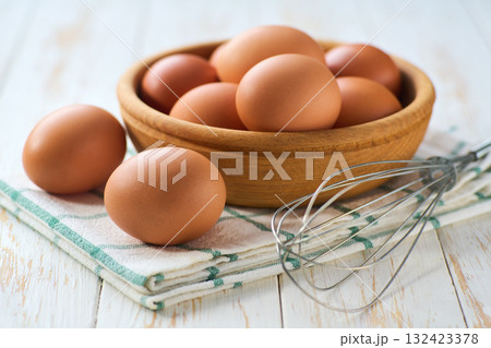 natural organic chicken eggs  on a light kitchen table, selective focus. 132423378