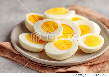 Healthy breakfast with minimal rustic style in kitchen concept. Delicious boiled eggs served on a stylish plate with texture. 132424844