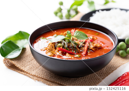 Thai red curry with pork and cooked rice with ingredients on white background Thai red curry with pork and cooked rice with ingredients on white background 132425116