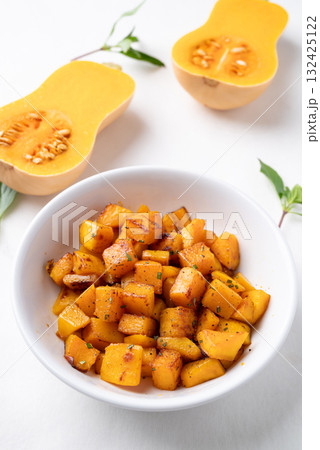 Roasted butternut squash pumpkin in a bowl on white background, Autumn homemade food Roasted butternut squash pumpkin in a bowl on white background, Autumn homemade food 132425122