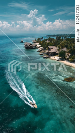 Aerial View of Tropical Island Resort with Speedboat in Turquoise Water 132427353