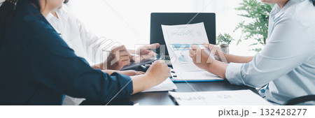 Panorama of corporate teamwork with people discussing financial reports, pointing at charts, planning business strategy, analyzing data and collaborating in office meeting for professional success. 132428277
