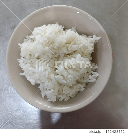 White rice plate cooked rice bowl served warm and simple comfort food for everyday meal White rice plate cooked rice bowl served warm and simple comfort food for everyday meal 132428552