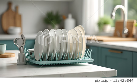 Sparkling Kitchen Serenity: Dishes Elegantly Awaiting Dryness on a Chic Drainer Under Gentle 132429844