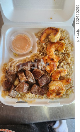 Assorted Grilled Meats, Shrimp, Vegetables, and Rice in Takeout Container with Sweet Sauce Assorted Grilled Meats, Shrimp, Vegetables, and Rice in Takeout Container with Sweet Sauce 132430299
