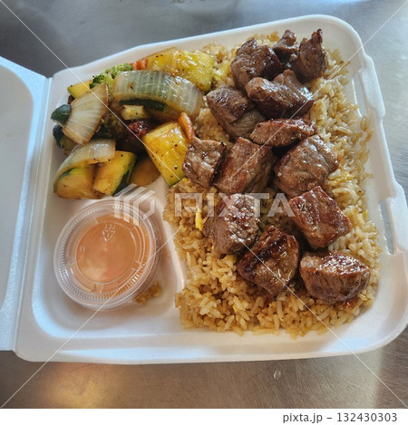 Assorted Grilled Meats, Shrimp, Vegetables, and Rice in Takeout Container with Sweet Sauce Assorted Grilled Meats, Shrimp, Vegetables, and Rice in Takeout Container with Sweet Sauce 132430303