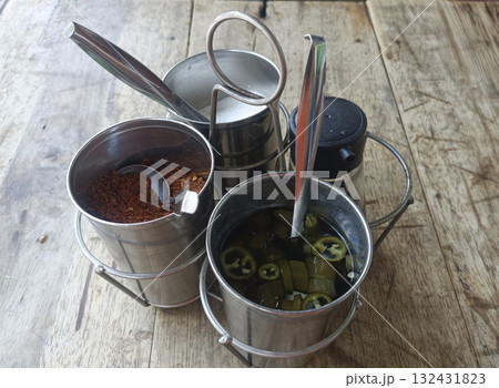 Spice caddy metal containers jalapeno chili flakes vinegar spoon rustic table condiment set add lively flavor Spice caddy metal containers jalapeno chili flakes vinegar spoon rustic table condiment set add lively flavor 132431823