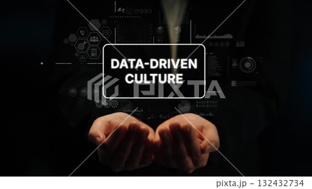 Hands Holding Text Representing Data-Driven Culture with Digital Interfaces and Analytics Graphics. Asymptotic smart data analytic Hands Holding Text Representing Data-Driven Culture with Digital Interfaces and Analytics Graphics. Asymptotic smart data analytic 132432734