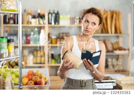 Adult woman scanning qr code of beans Adult woman scanning qr code of beans 132433161
