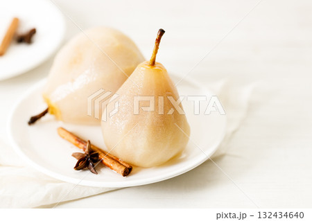 Poached pears with spices in syrup. Poached pears with spices in syrup. 132434640