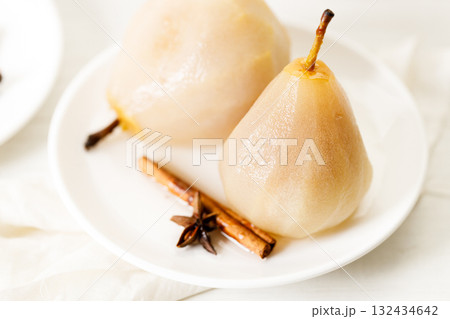 Poached pears with spices in syrup. Poached pears with spices in syrup. 132434642