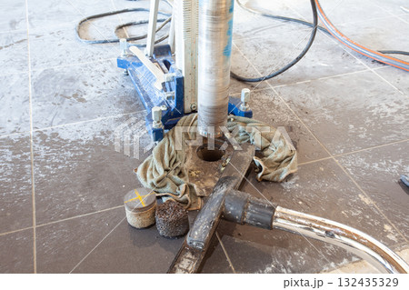 Diamond drill on tripod 132435329