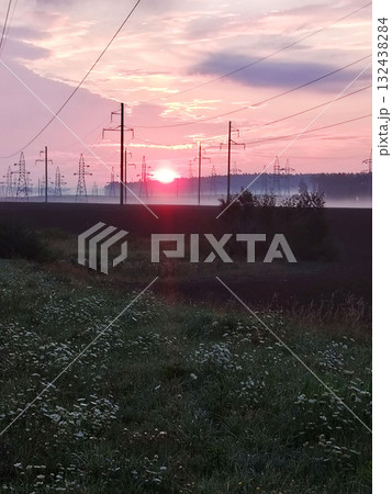 Sunrise over field with power lines. Sunrise over field with power lines. 132438284