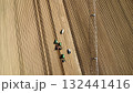 Aerial View of Tractors Preparing Farmland for Planting Season 132441416