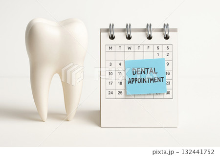 Tooth with mini calendar and reminder note. Clean mockup concept for dental appointment and oral health awareness. Tooth with mini calendar and reminder note. Clean mockup concept for dental appointment and oral health awareness. 132441752