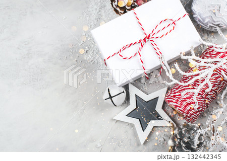Festive Christmas background with gift boxes and Christmas decorations. Festive Christmas background with gift boxes and Christmas decorations. 132442345