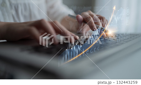 Person Typing on Laptop with Financial Graph Overlay and Data Analysis, Business Growth Concept in Modern Workspace Environment Scalp Person Typing on Laptop with Financial Graph Overlay and Data Analysis, Business Growth Concept in Modern Workspace Environment Scalp 132443259