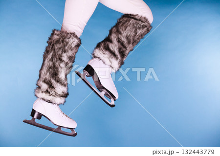 Woman legs wearing ice skates fur socks, skating Woman legs wearing ice skates fur socks, skating 132443779