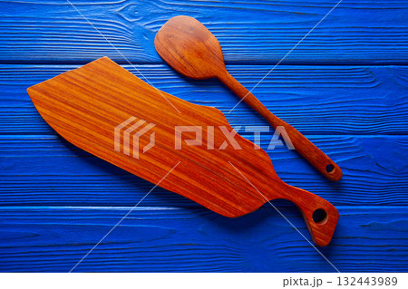 Chef tool spatula and table board on blue Chef tool spatula and table board on blue 132443989